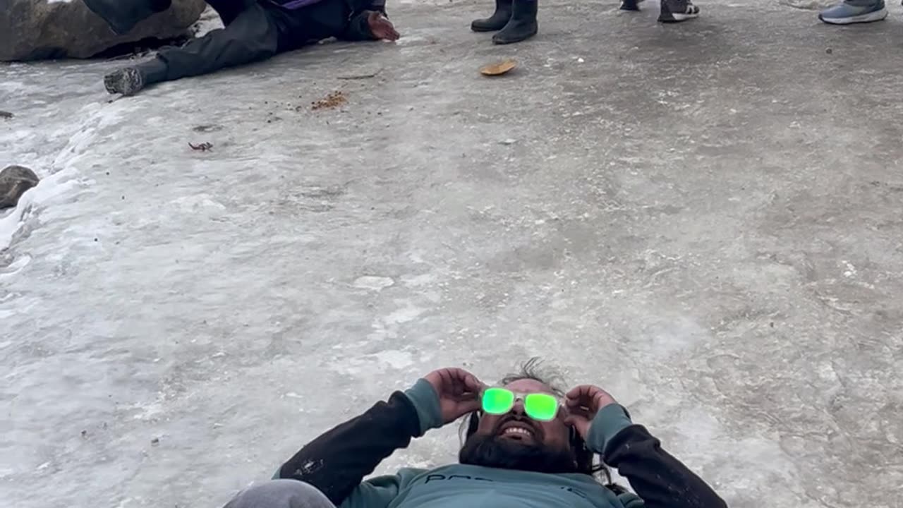Friends Slip In Sync On Icy Path