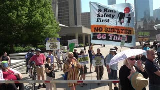 Carbrained Protest faces opposition on the north west corner of city hall/Nathan Phillips square