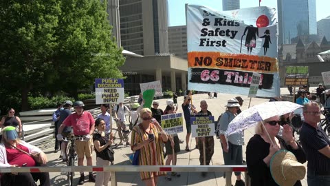 Carbrained Protest faces opposition on the north west corner of city hall/Nathan Phillips square