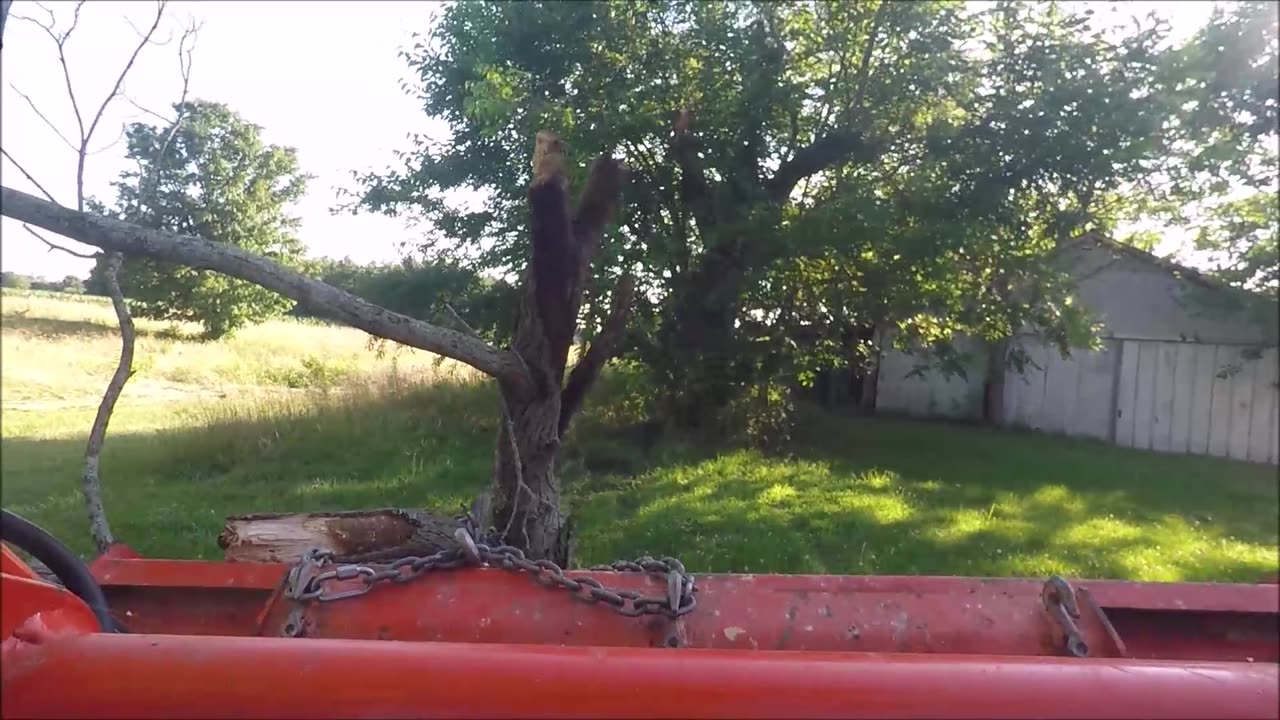Kubota Tractor Storm damage clean up Moving tree limbs and mowing Homesteading farm life