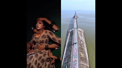 On one side, the beauty of the Haor bridge. On the other side, the girl’s shooting is going on.