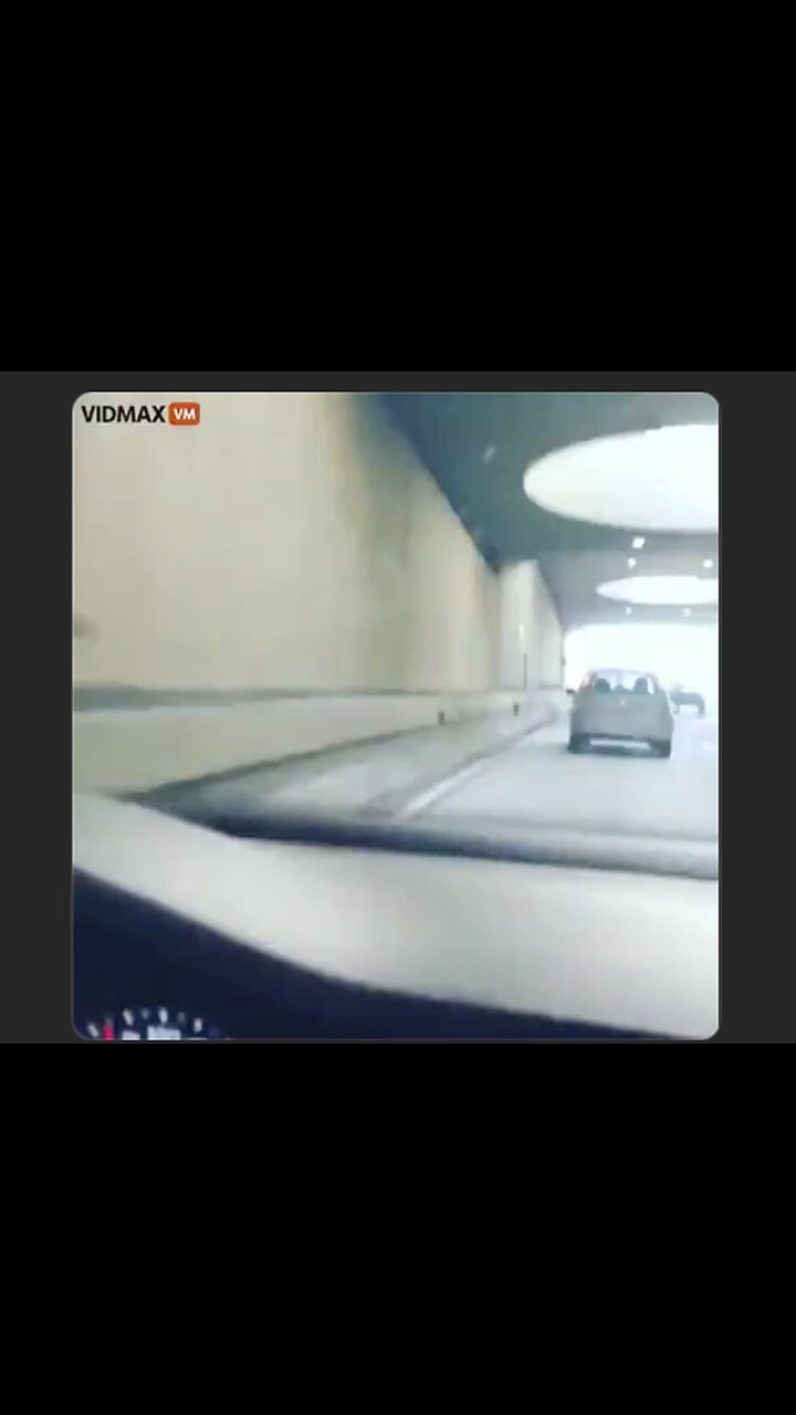 Man on motorcycle kicks car while traveling down the highway...a lesson in physics the hard way