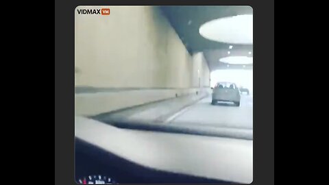 Man on motorcycle kicks car while traveling down the highway...a lesson in physics the hard way