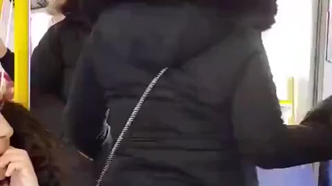 He forces the old Swedish woman to get up because he wants to sit in her place.