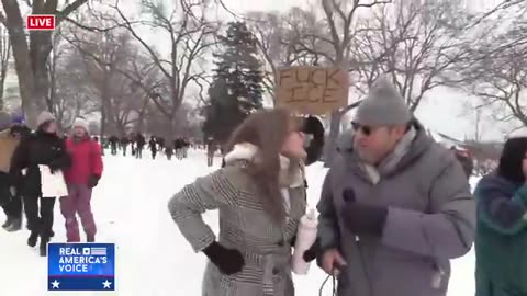 Protester Heckling Journalist Doesn't Seem to Realize She Comes Across as Retarded