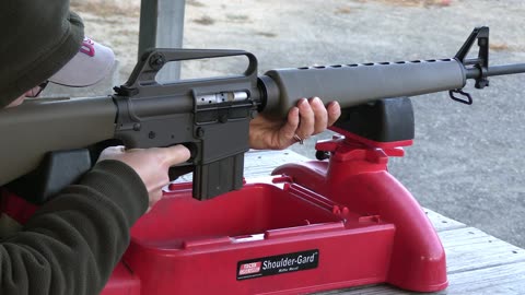 Mrs Koba tries out the Retro AR 601 rifle