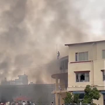 Nepal unrest people tearing the flag