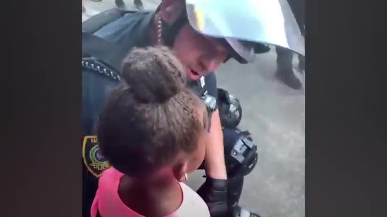 Police officer confronts a little girl after a misunderstanding.