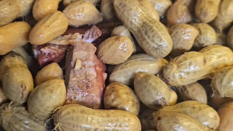 Green Peanuts boiled with smoked neckbones in crockpot