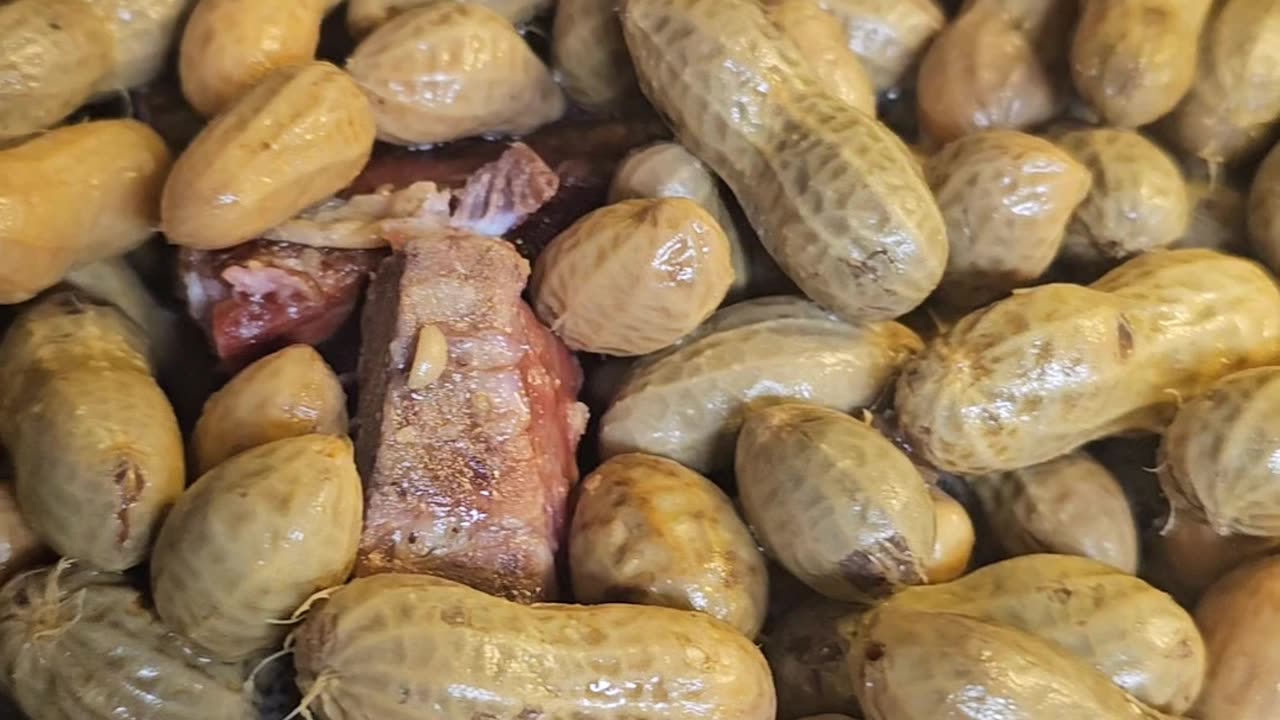 Green Peanuts boiled with smoked neckbones in crockpot