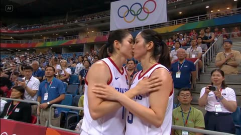 Golden Medal Kiss – Two Olympian Basketball Players Share a Victory Moment