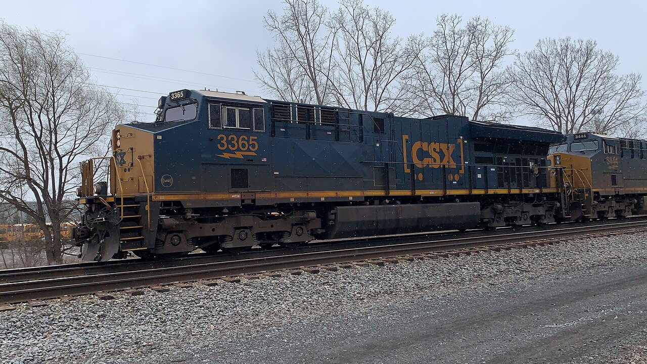 CSX Train engines 3365 and 3444 rolling down the rails
