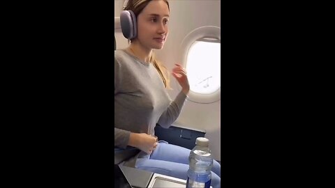 Straighten her outfit on the plane