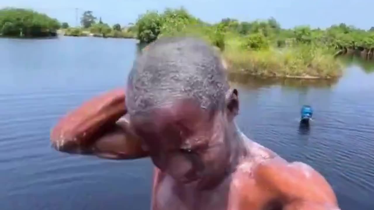 Man nearly gets harpooned intentionally and is chased while taking a river bath