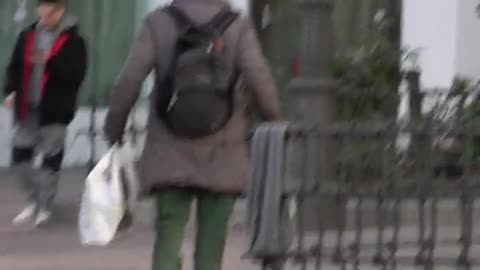 Man Hobbles Along Carrying Groceries