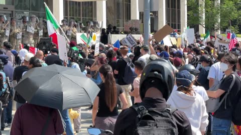 Protesters amass outside federal building in Los Angeles