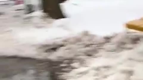 Guy stands in front of snow plow to keep it from pushing snow on to his driveway