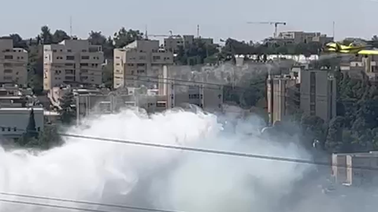 Firefighters work to contain fire near Highway 9 in Jerusalem