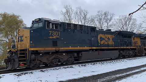 CSX engines 7301 and 5379 head East on the incoming track