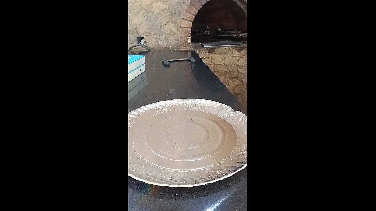 Pizza cooking in tandoor