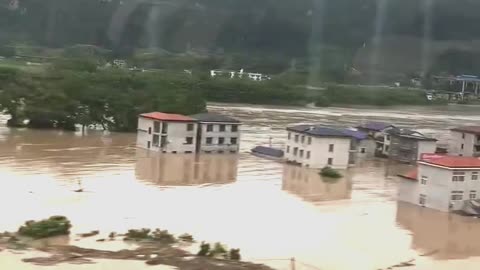 China floods 2025: shocking view from a moving train.