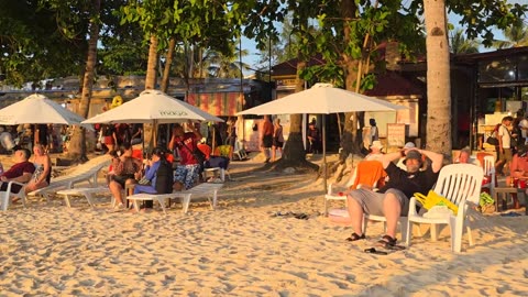 Enjoying the Sunset at the Beach in a Crowded Evening On November 7, 2025