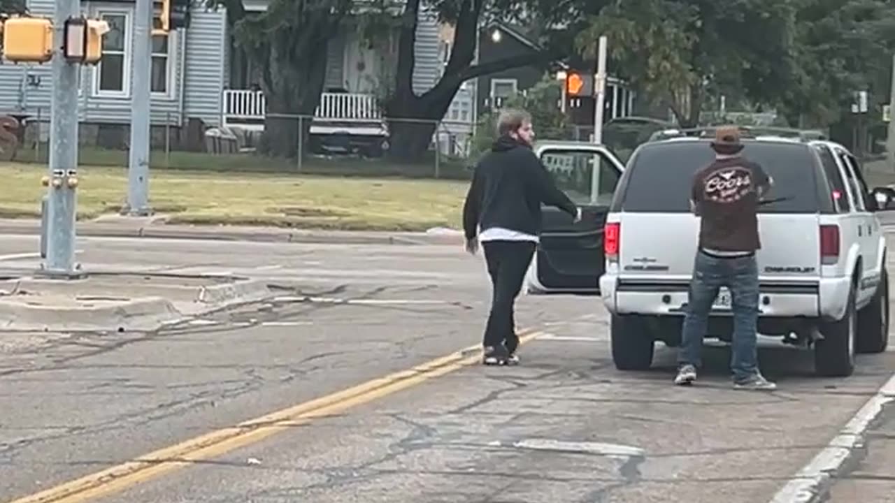 Two Men Spotted Fighting at a Stoplight