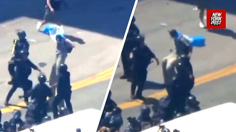 Shocking moment stilt-walking protester taken down by LAPD
