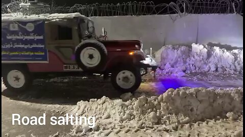 SALTING ROAD IN SNOW
