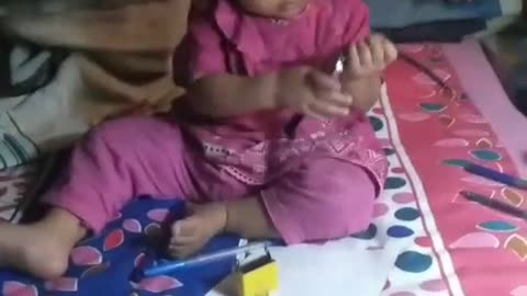 Cute baby Listening to like Mobile catching watch