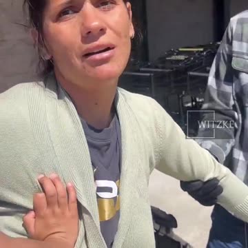 Woman with child accused of stealing being detained by security at grocery store