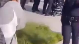 A man in an electric wheelchair running from the cops