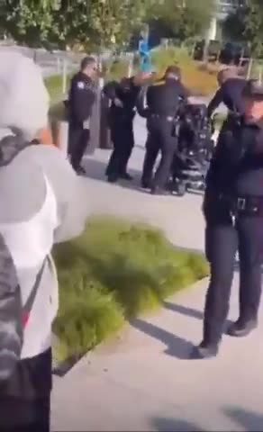 A man in an electric wheelchair running from the cops