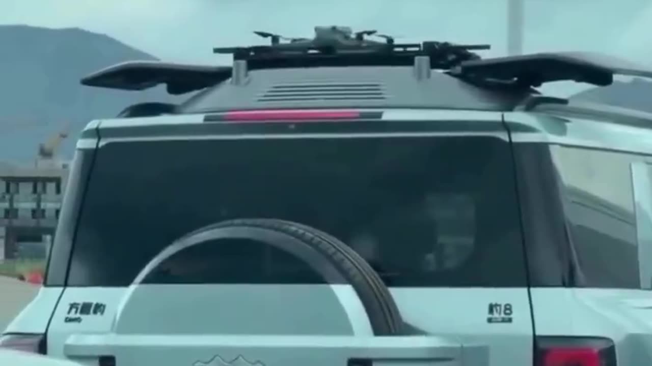 This man deployed built in drone to see traffic ahead.