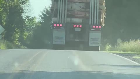 Lumber Truck Loses A Log