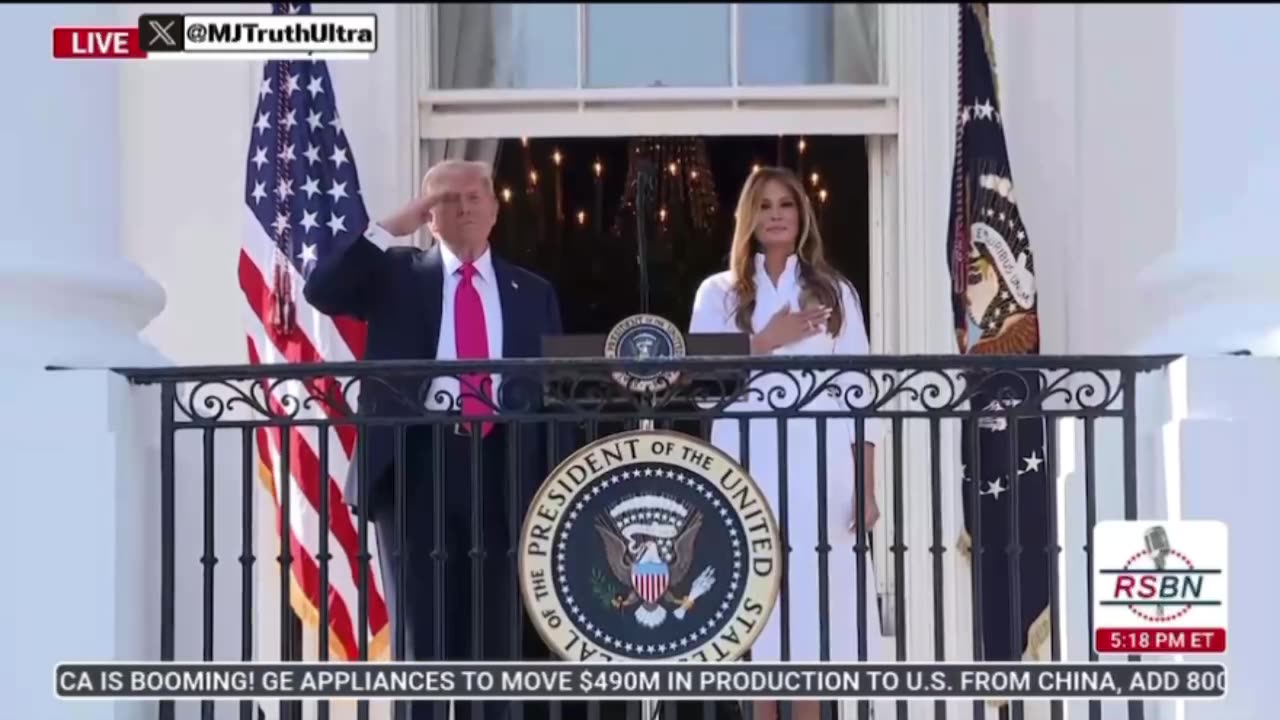 President Trump salutes a B-2 Spirit Bomber as it flys overhead.