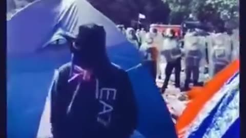 NZ police lighting tents on fire at protest