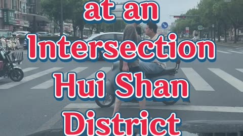 Waiting at an intersection in the Huishan District of Wuxi, China