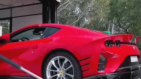 🚗 Catch the Action: Ferrari Loaded onto an Enclosed Trailer!