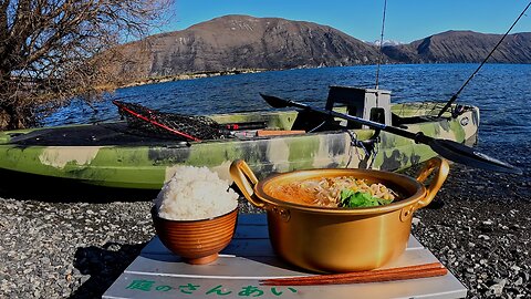 Cooking spicy hot pot at the lake
