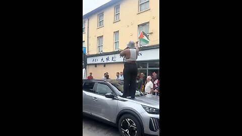 Pro-Palestine activist stands on a car and blocks traffic in Greenwich, London