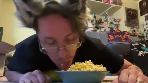 Man who identifies as a furry lies on the floor to eat