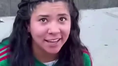 Woman happy about running her motorcycle into police