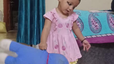 Baby apni Doraemon toy ke sath