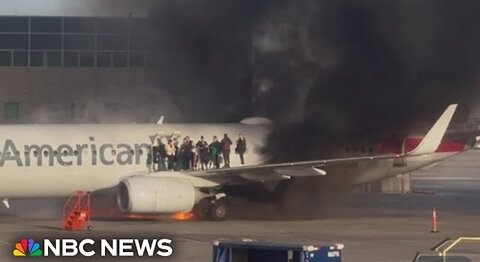 American Airlines plane catches fire at Denver International Airport