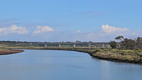 Train Crossing a Bridge in the Distance