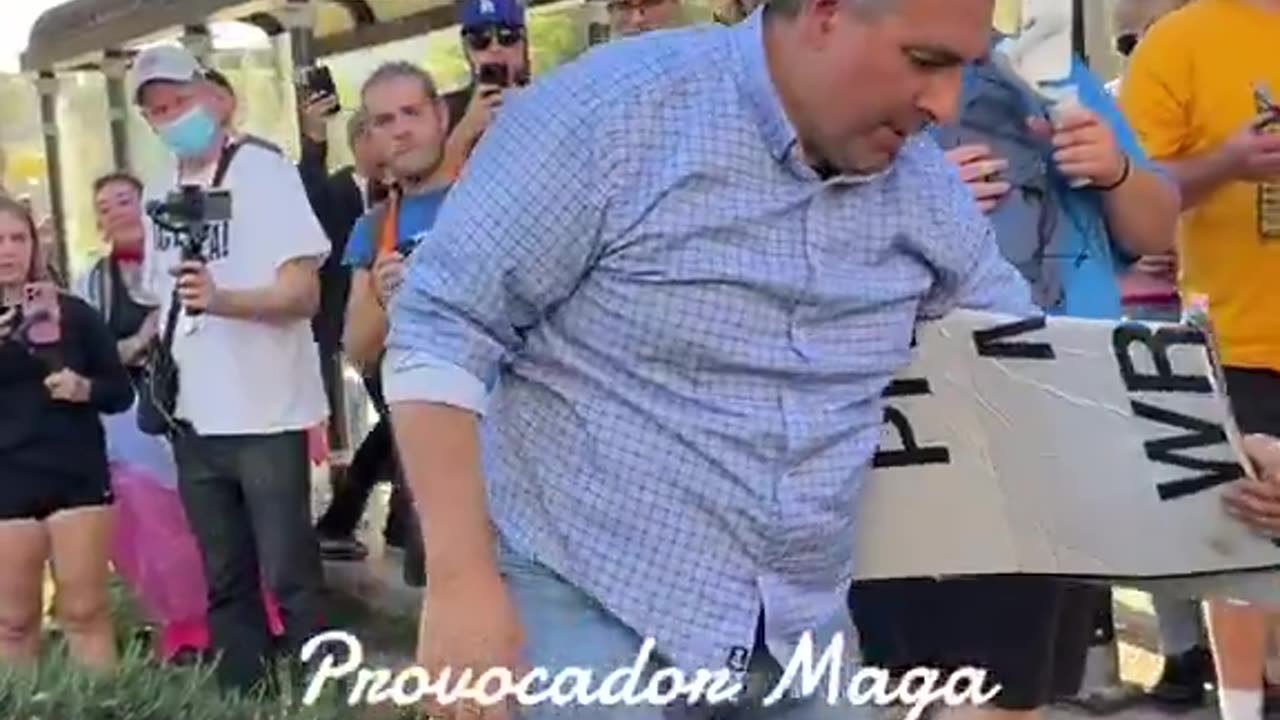 Man holding a "You proved Charlie right" sign was ATTACKED and pushed to the ground