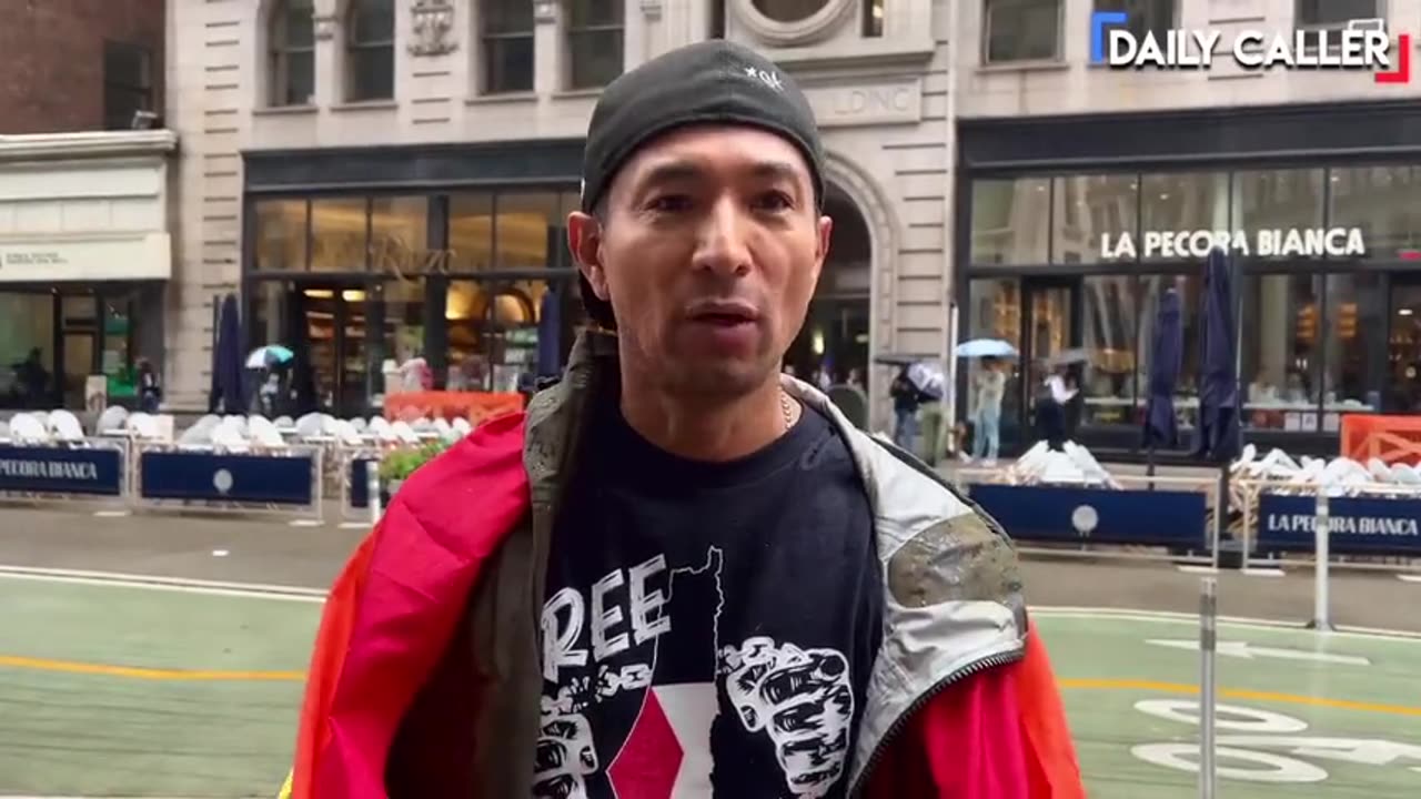 Hispanic guy protesting Trump Makes Excuses for Illegal Immigration