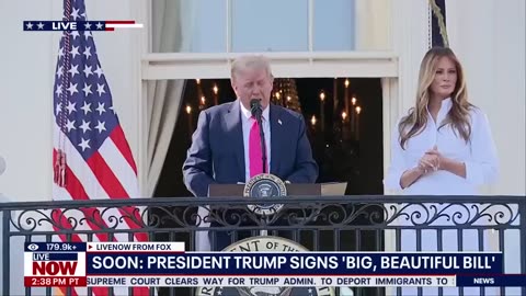 President Trump signs legislation at a Fourth of July celebration at the White House