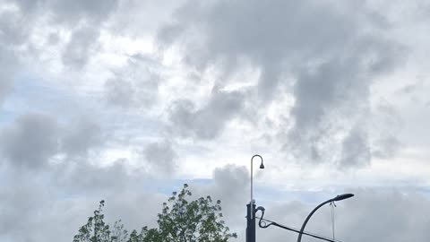 Layered "clouds" blocking the direct light from the white sun & yellow sun